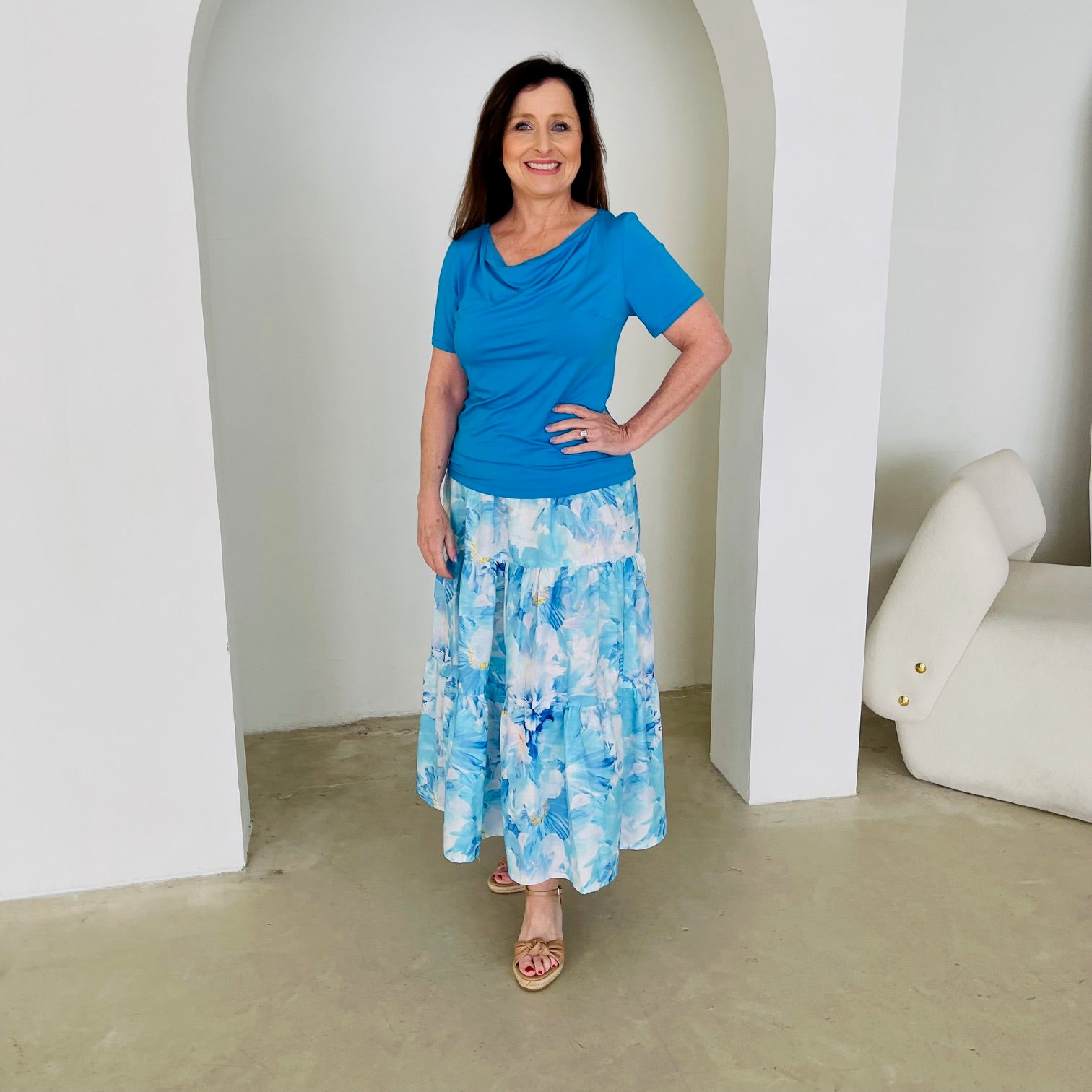 Turquoise blue bamboo, short sleeve, cowl neckline top, with midi length floral skirt.