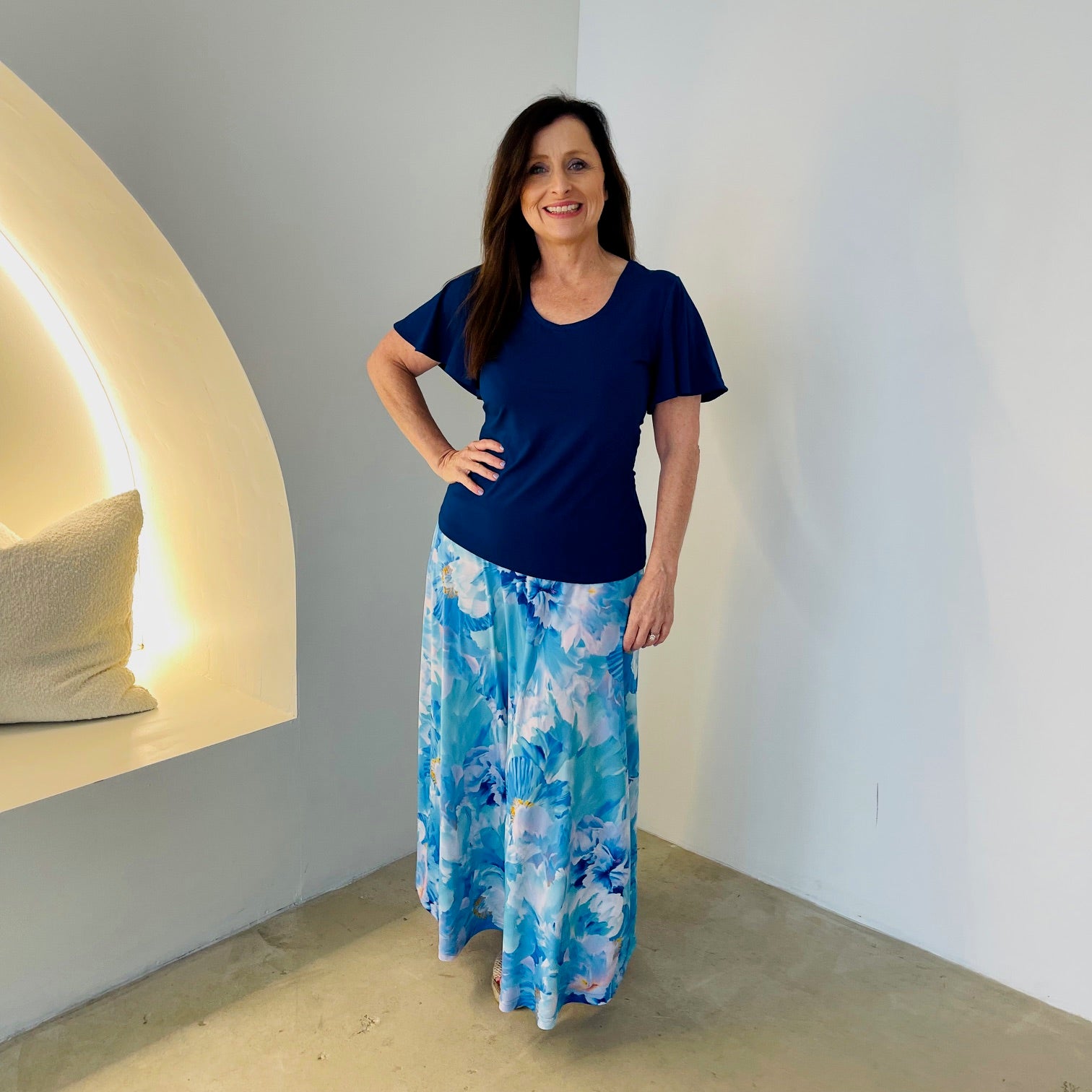 Long, maxi length, blue floral skirt with stretch elastic waistband,with navy blue, round neckline,short sleeve top.