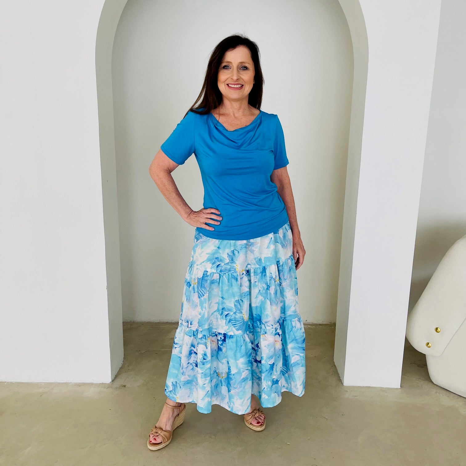 Turquoise blue bamboo, short sleeve, cowl neckline top, with midi length floral skirt.