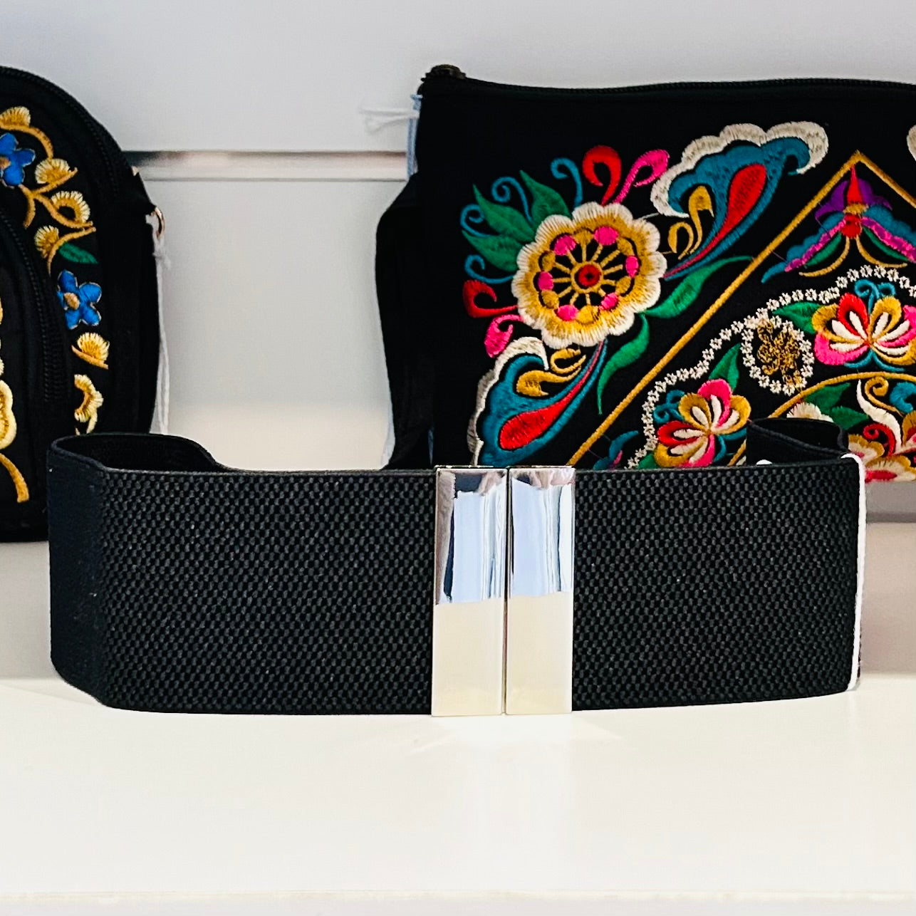 Black elastic stretch belt with silver clip buckle