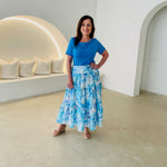 Turquoise blue bamboo, short sleeve, cowl neckline top, with midi length floral skirt.