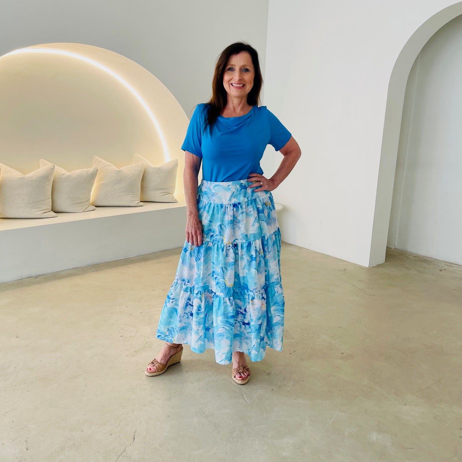 Turquoise blue bamboo, short sleeve, cowl neckline top, with midi length floral skirt.