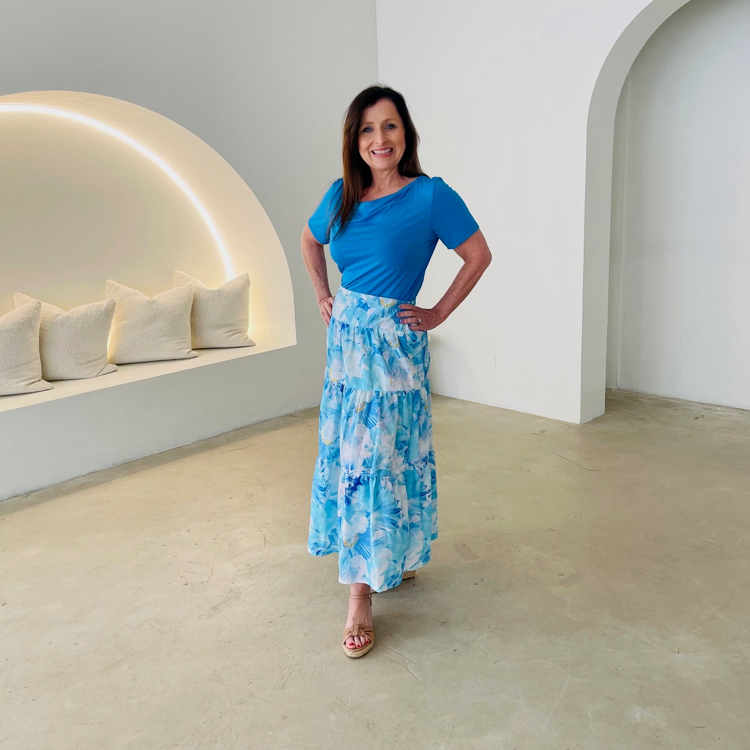 Turquoise blue bamboo, short sleeve, cowl neckline top, with midi length floral skirt.