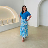 Turquoise blue bamboo, short sleeve, cowl neckline top, with midi length floral skirt.