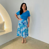 Turquoise blue bamboo, short sleeve, cowl neckline top, with midi length floral skirt.