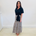 Maxi, long, tiered skirt in a black, white & red pattern print, worn with short sleeve, side tie on waistline, v neckline,collared, women's, linen shirt