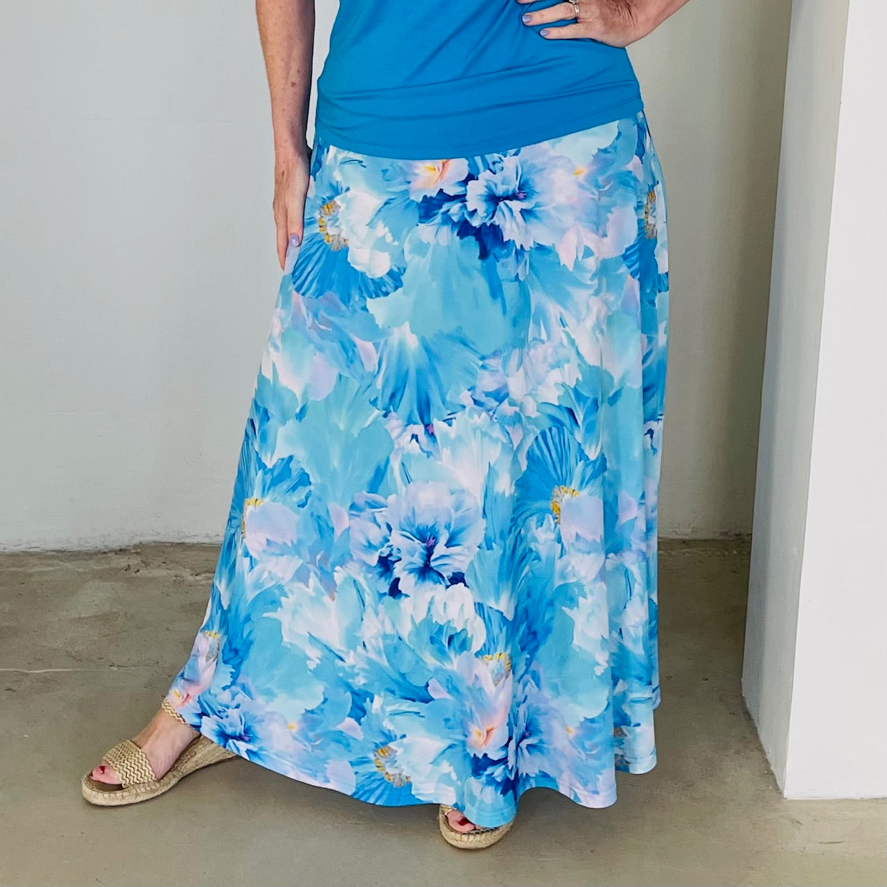 Long, maxi length, blue floral skirt with stretch elastic waistband,with turquiose blue, cowl neckline,short sleeve top.