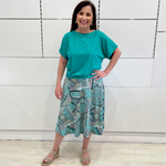 Midi length A line skirt, in pattered fabric of teal, green, black & white. Stretch elastic waistband, that sits flat across your tummy.