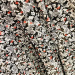 100% linen with a White, black and red delicate flower print tiered skirt flat waistband with elastic through the bac
