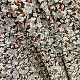 100% linen with a White, black and red delicate flower print tiered skirt flat waistband with elastic through the bac