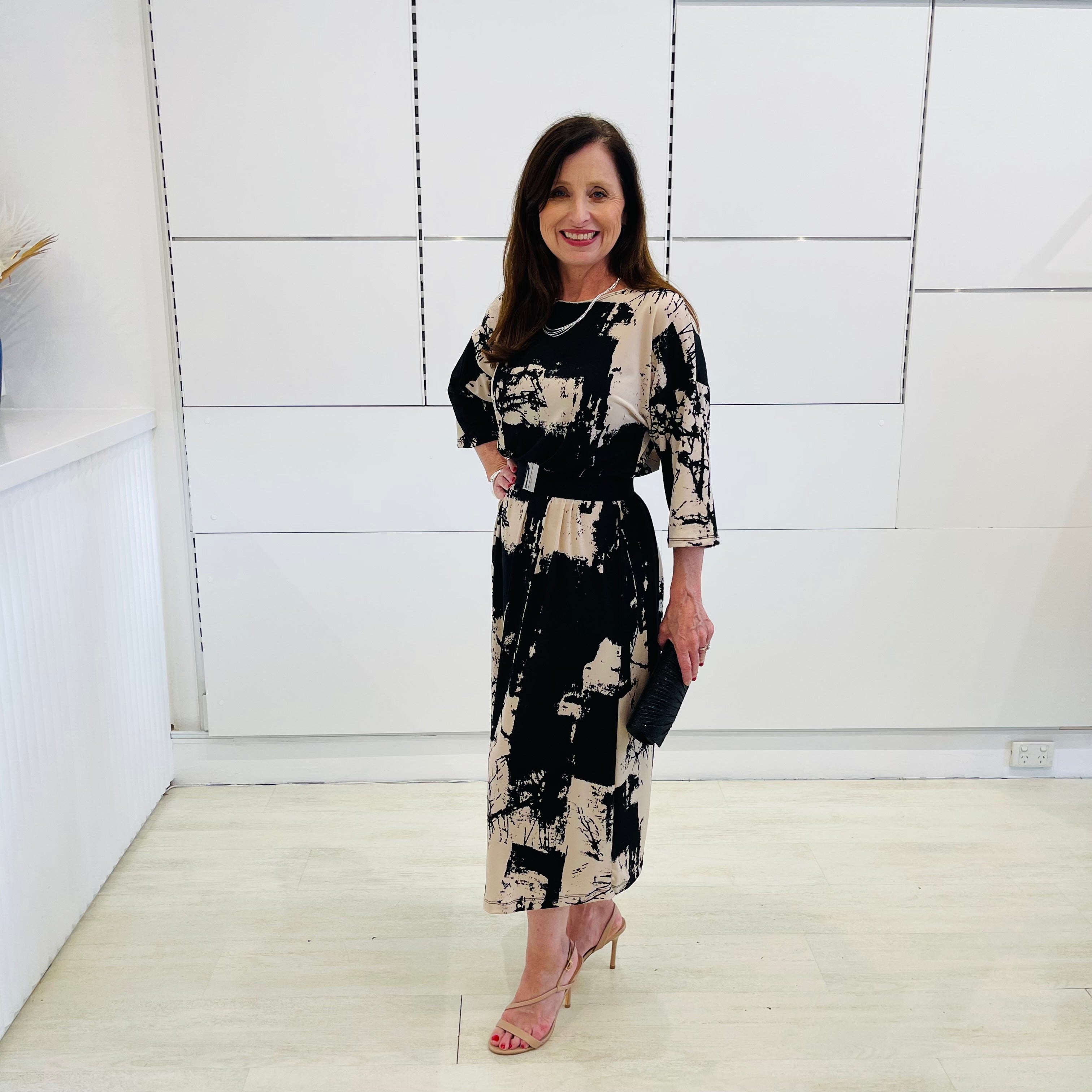Black and beige print, 3/4 sleeve, midi length dress for special event wear.