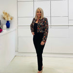 Black short, bolero jacket with all over multi coloured embroidery.