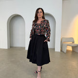 Black short, bolero jacket with all over multi coloured embroidery.With matching strapless embroidered bodice dress, with pockets .