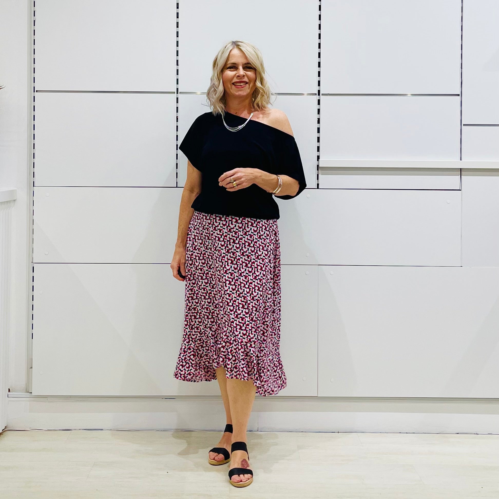 Black, relaxed fit, loose line, off the shoulder, asymmetrical neckline top. Made in Australia.