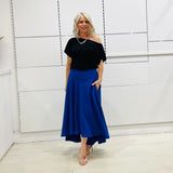 Royal blue,long, maxi,dipped hemline, flat fitted waistband ,skirt with pockets. Worn with black off the shoulder top
