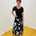 Arulean print long aline skirt stretch fabric black background with a green, cobalt blue and white floral print flat stretch waistband True Reflections Clothing Gymea