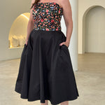 Embroidered floral strapless dress with pockets.