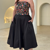 Embroidered floral strapless dress with pockets.
