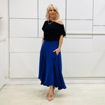 Royal blue,long, maxi,dipped hemline, flat fitted waistband ,skirt with pockets. Worn with black off the shoulder top