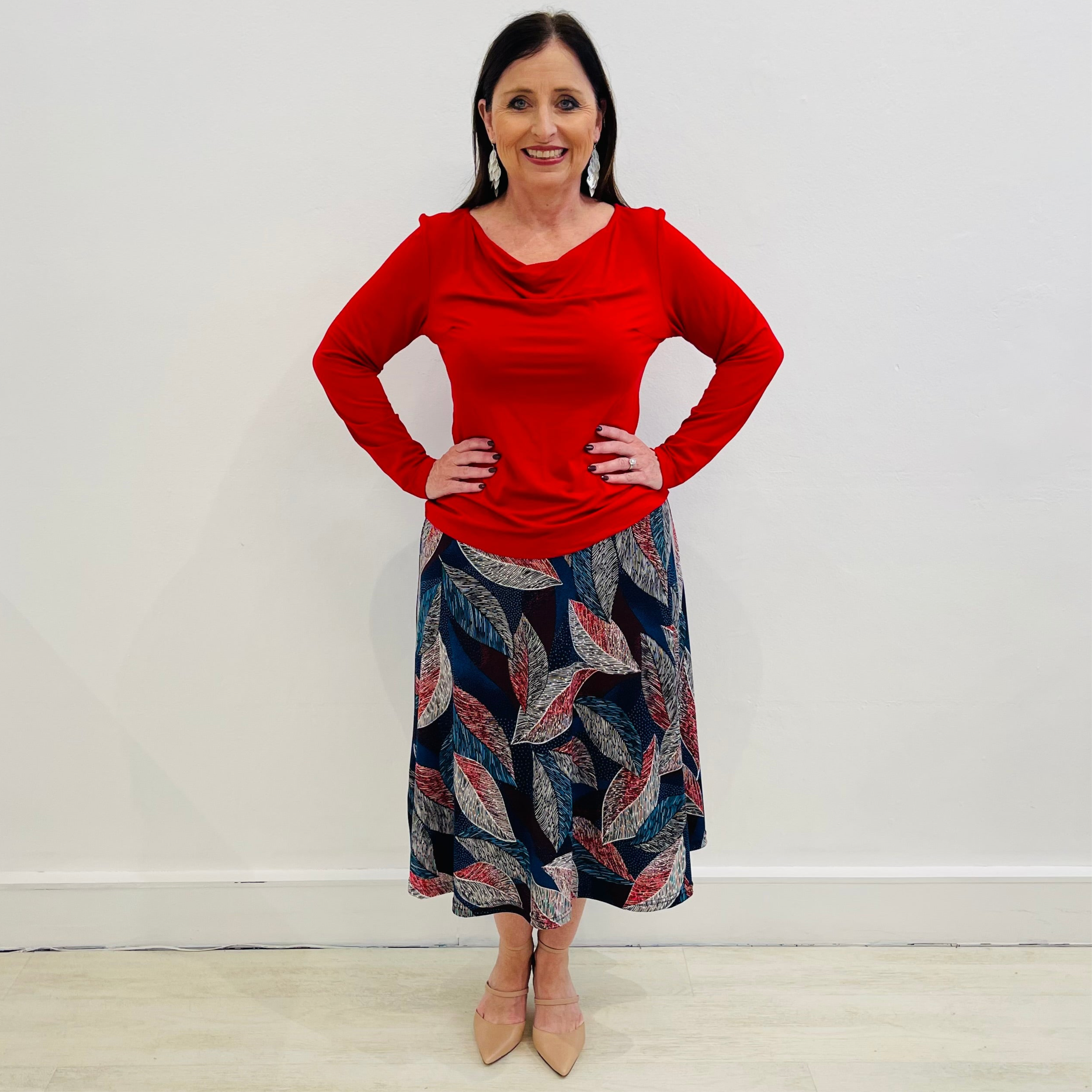 Red cowl neckline, long sleeve, bamboo top,With blue, red leave print, midi length, a line, stretch skirt.