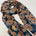 Navy background with frangipani print chiffon scarf