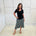 Green,black and white print, stretch, slight a-line skirt, with small ruffle on hemline. Worn with black bamboo, short sleeve top.