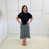 Green,black and white print, stretch, slight a-line skirt, with small ruffle on hemline, & black bamboo, short sleeve, scoop neckline, relaxed fit top