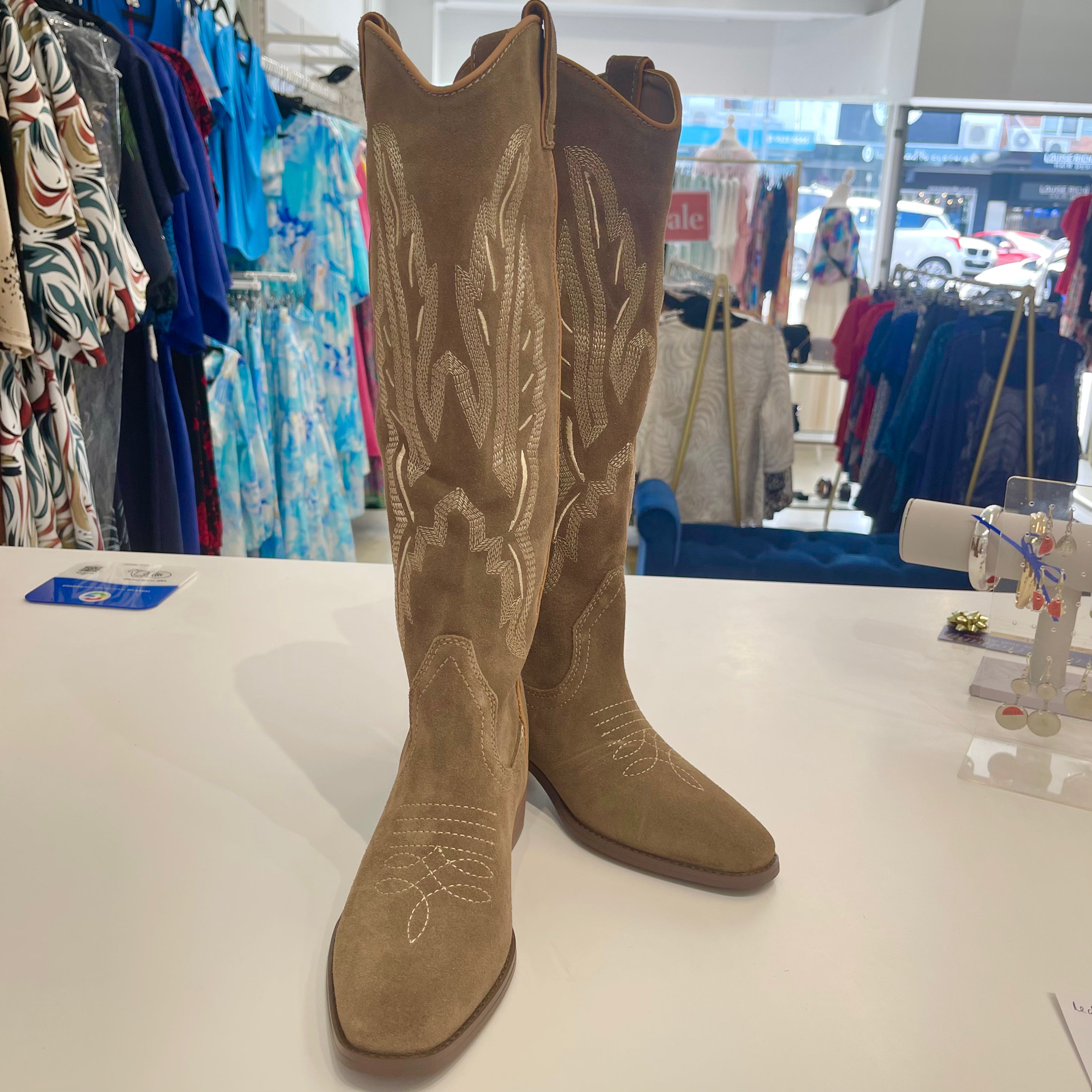 Tan Beige leather suede soft cowboy style boots, with embroidered front and back, pull on style, with rounded toes.