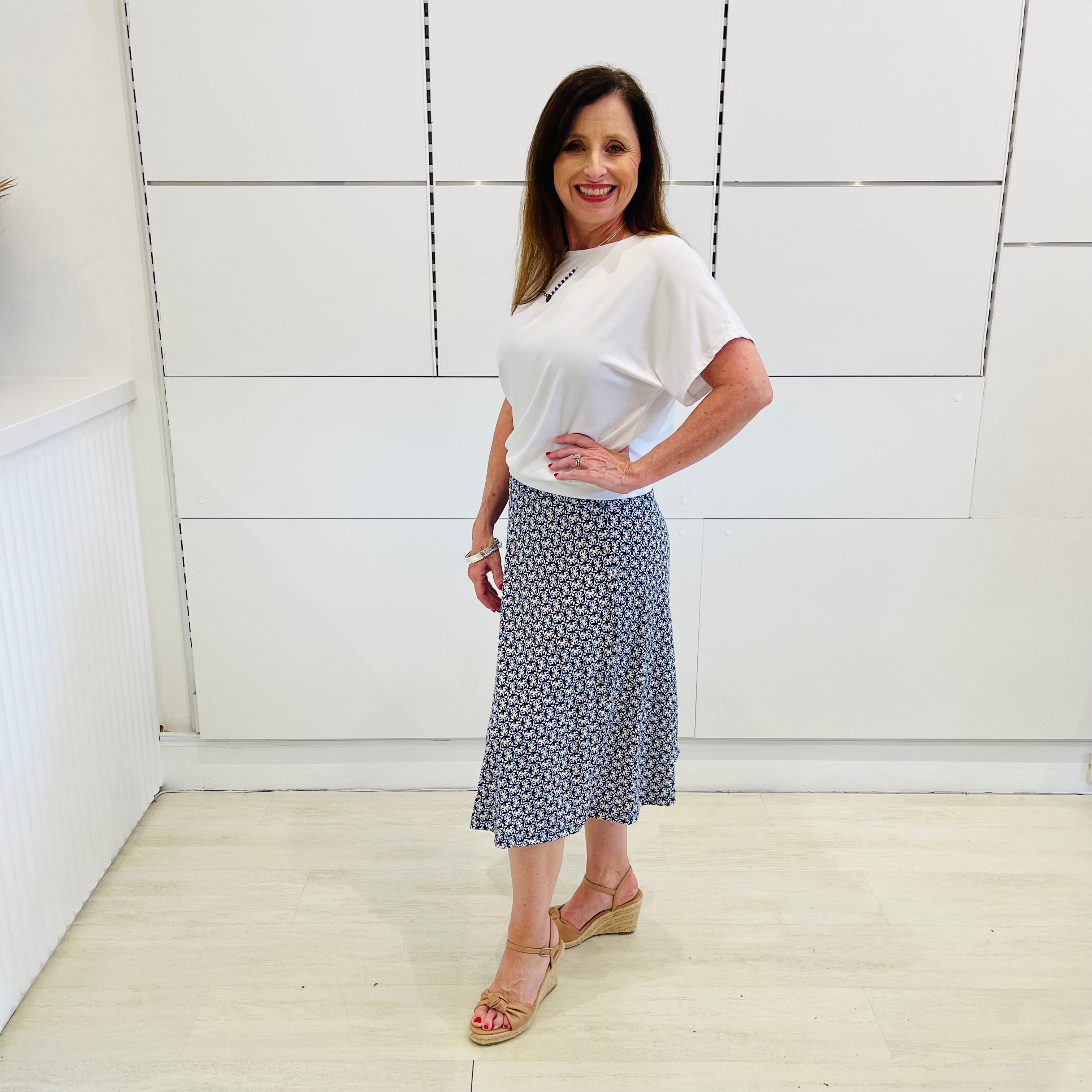 Mosaic blue, midi length, stretch, a-line skirt,with white bamboo, short sleeve, relaxed fit top.
