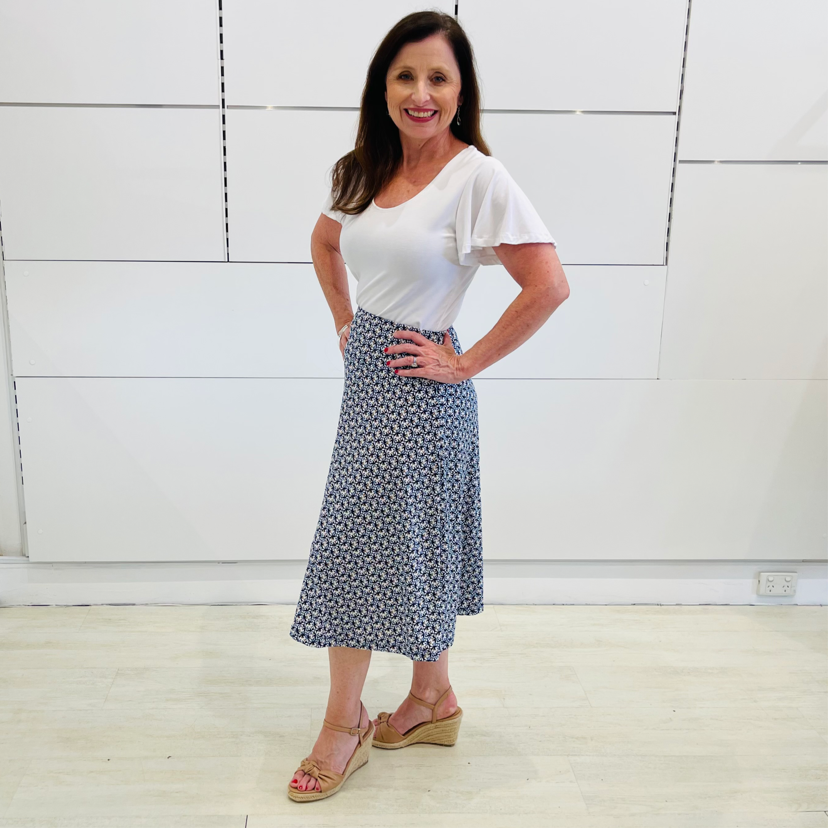Mosaic blue, midi length, stretch, a-line skirt,with white bamboo, short sleeve, wave sleeve, scoop neckline, fitted top.