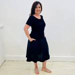 Black linen, midi length, skirt with lace detail on hemline,stretch elastic waistband, worn with black bamboo, short sleeve, cowl neckline top.