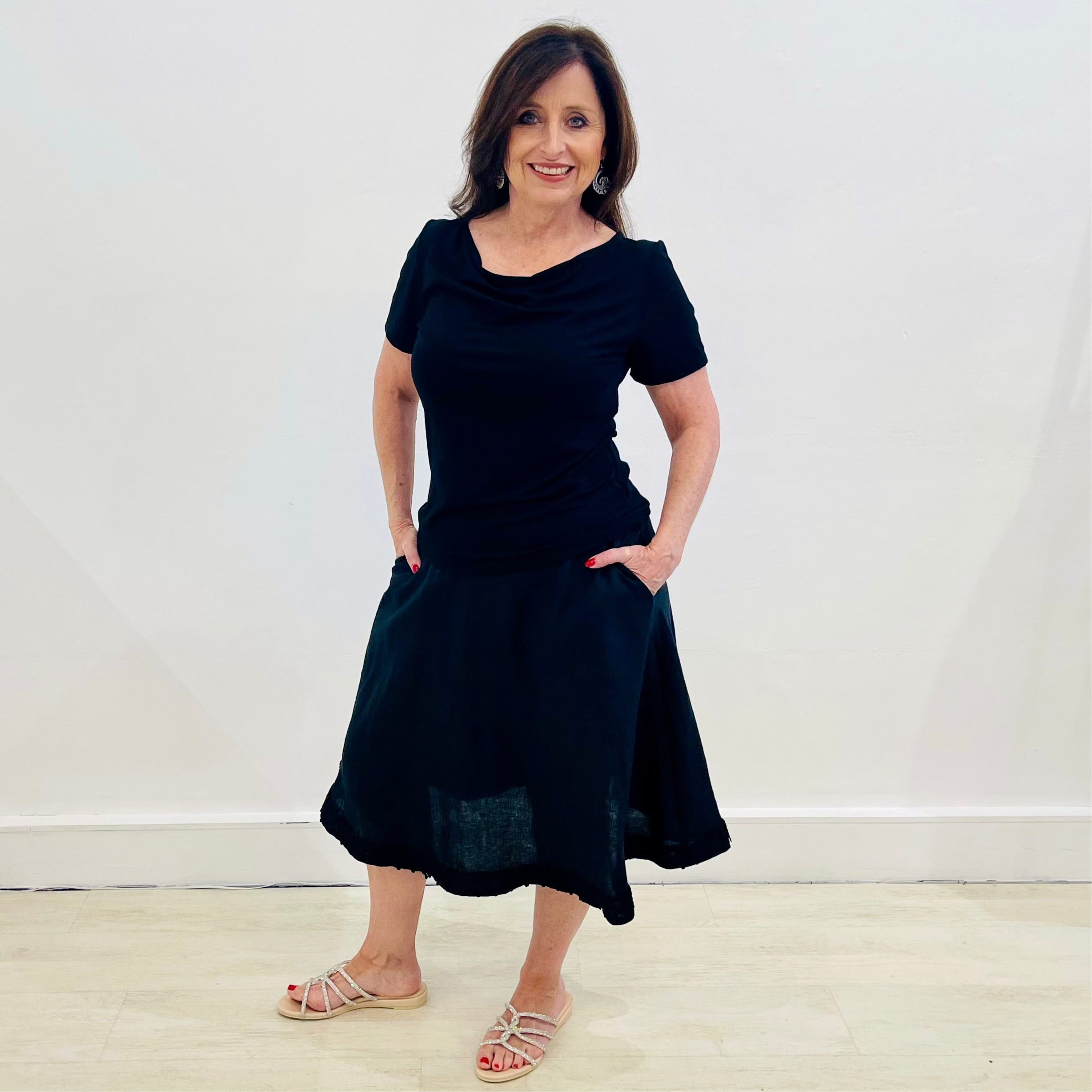 Black linen, midi length, skirt with lace detail on hemline,stretch elastic waistband, worn with black bamboo, short sleeve, cowl neckline top.