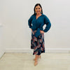 Teal Linen Long Sleeved Shirt with side tie detail at hemline. Autumn Radiance Aline Skirt with a leaf print in white, reds, teals, navy and black midi length skirt made in a stretch jersey flat discreet elastic through waistband.