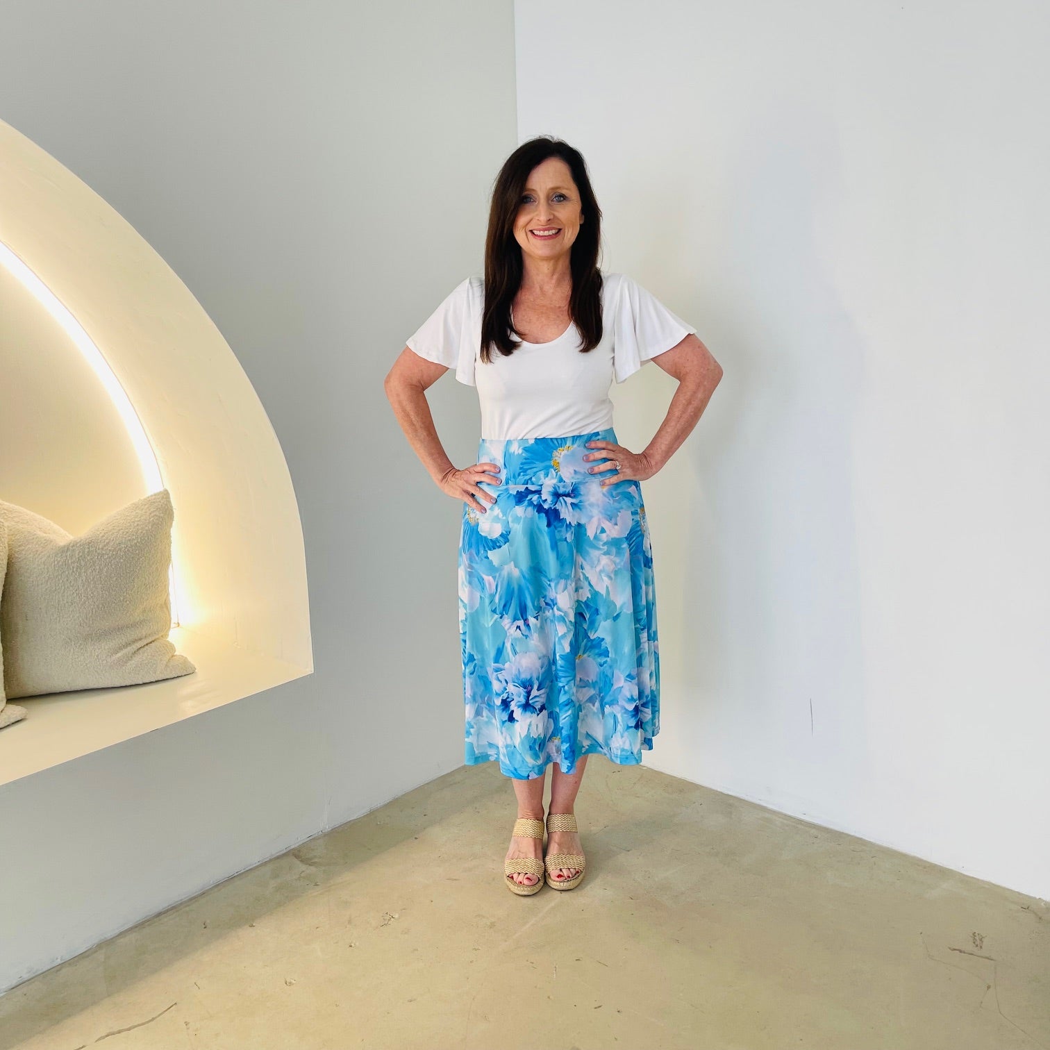 Blue & white floral print, midi length, stretch, a-line skirt,with stretch elastic waistband, white short sleeve, round neck top.