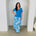 Long, maxi length, blue floral skirt with stretch elastic waistband,with turquiose blue, cowl neckline,short sleeve top.