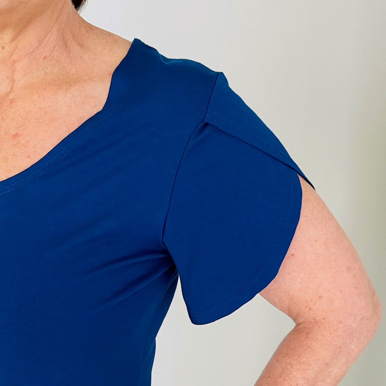 Navy bamboo, round neckline,short sleeve top. Cross over tulip sleeve detail.