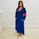 Sapphire Swirl Skirt, royal blue, soft drapey, full circle skirt with dipped hemline at back, wide flat waistband and pockets.  Scoop, round neckline, long,puff gathered sleeve, fitted women's top blouse