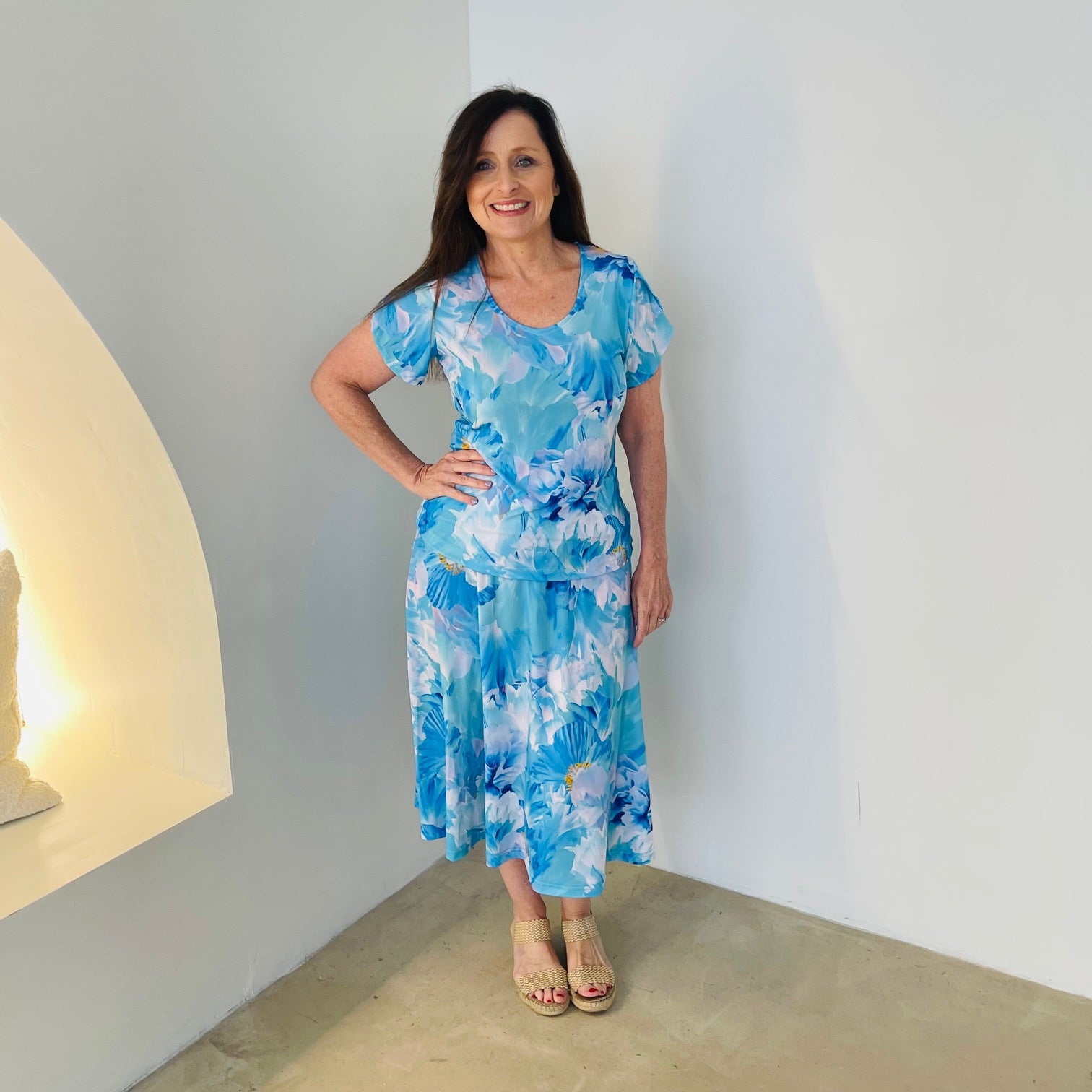 Blue floral, round neckline, short cross over sleeve top with matching blue floral midi length skirt.