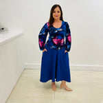 Sapphire Swirl Skirt, royal blue, soft drapey, full circle skirt with dipped hemline at back, wide flat waistband and pockets. Scoop, round neckline, long,puff gathered sleeve, fitted women's top blouse