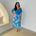 Turquoise blue bamboo, short sleeve, cowl neckline top, with midi length floral skirt.