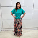 Emerald green bamboo, relaxed fit, scoop neckline , short sleeve, summer top, with band on hem for shape. Worn with long maxi skirt in Aztec print fabric.