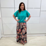 Emerald green bamboo, relaxed fit, scoop neckline , short sleeve, summer top, with band on hem for shape. Worn with long maxi skirt in Aztec print fabric.