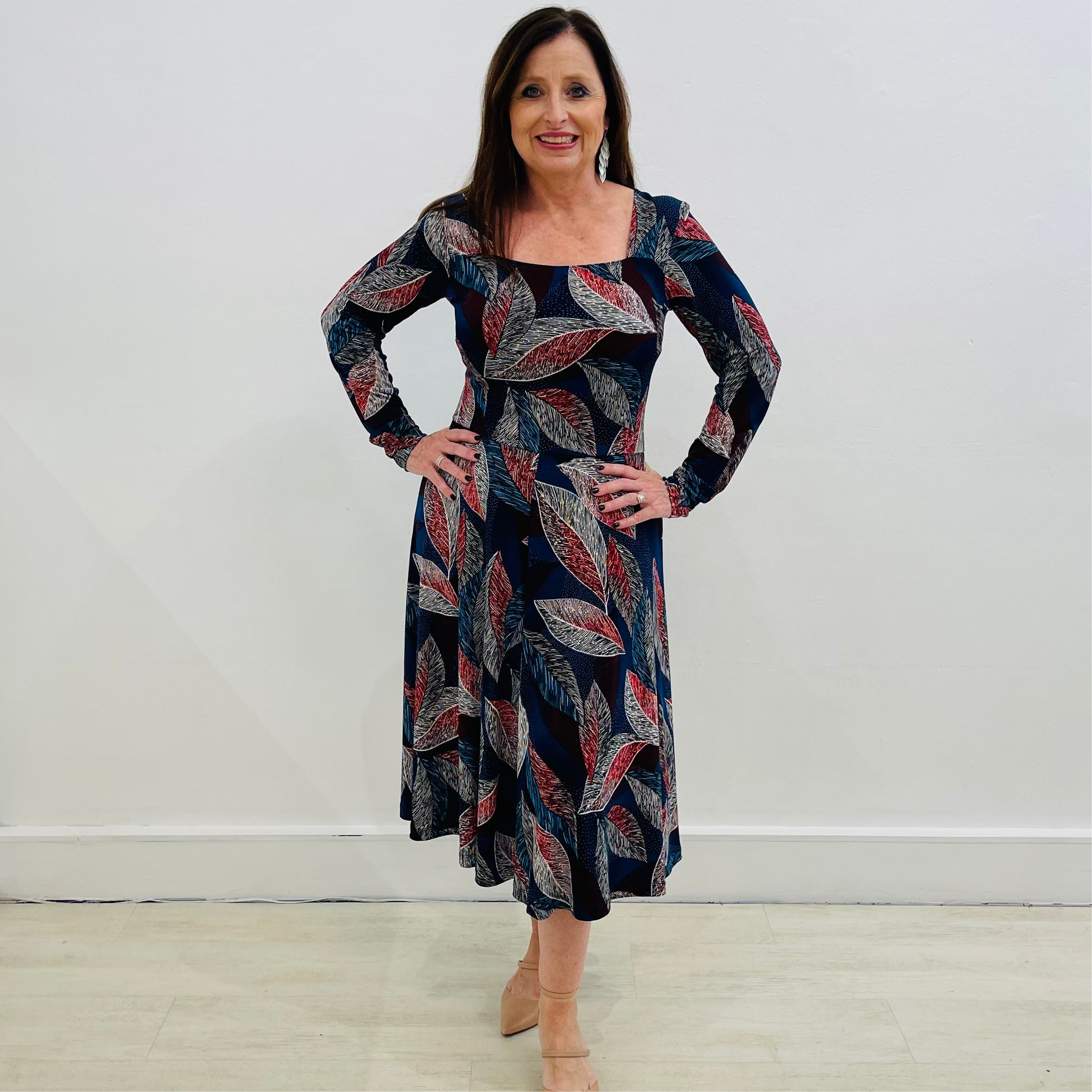 Patterned print dress in colors of red,blue,white, black, long fitted sleeve, with square neckline, flattering waistline seam, panelled, a line , midi length dress.