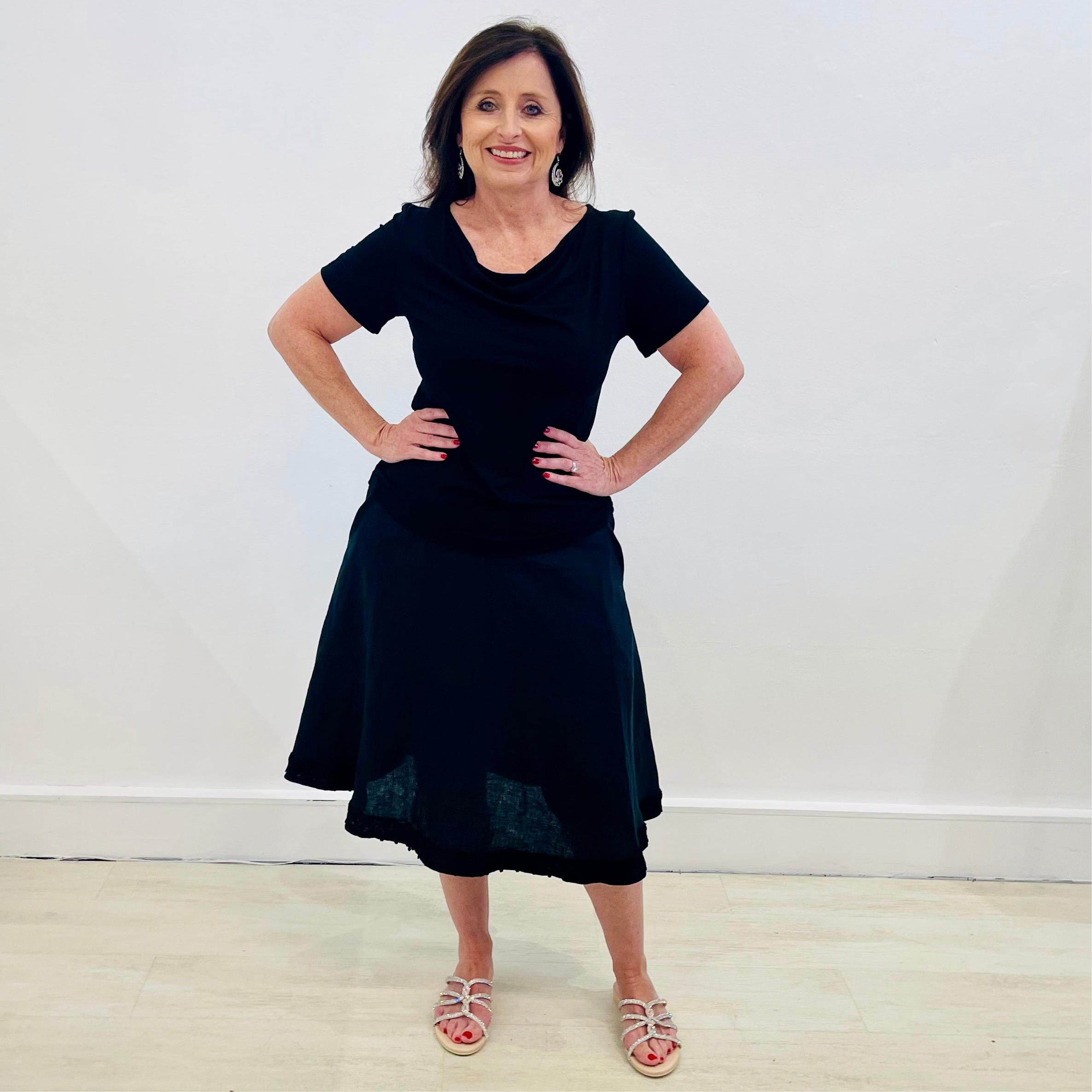 Black linen, midi length, skirt with lace detail on hemline,stretch elastic waistband, worn with black bamboo, short sleeve, cowl neckline top.