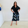 Arulean print midi length aline skirt stretch fabric black background with a green, cobalt blue and white floral print flat stretch waistband True Reflections Clothing Gymea