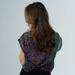Chameleon top on model in white room 
