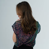 Chameleon top on model in white room 