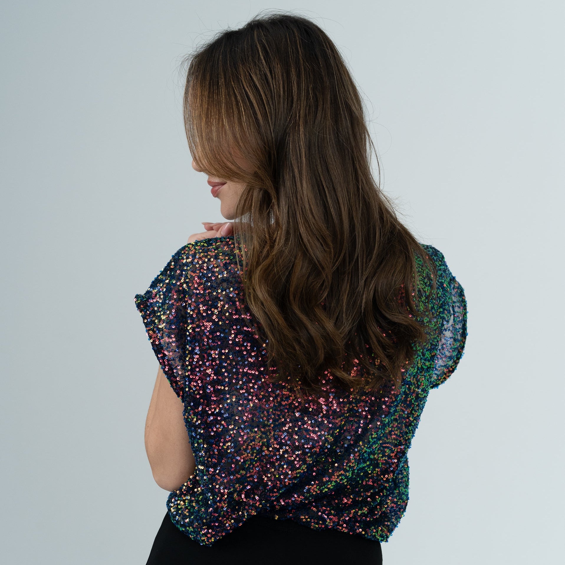 Chameleon top on model in white room 