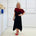 Black & red floral print, off the shoulder, asymmetrical neckline, relaxed fit top, worn with black, handkerchief hemline skirt with elastic waistband.