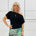 Relaxed fit, black ff the shoulder top with waist shape band. 